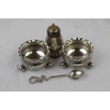 Pair of Victorian silver open salt cellars raised on three bun feet, fluted rims, engraved foliate