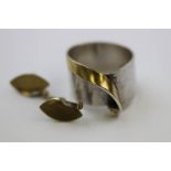 Diamond silver and gilt modernist asymmetric ring, the small round eight cut diamond rub over set