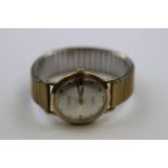 Gents 21 Jewel hallmarked 9ct Gold Wristwatch, marked "Garrard" to the silvered metallic dial with