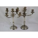 Pair of 800 grade silver five branch candelabra, each branch formed as an eagle head with gadroon