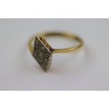 Diamond 18ct yellow gold platinum set ring, the lozenge shaped head with nine small eight cut
