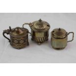 Three unassociated silver lidded salt cellars comprising Victorian circular form salt cellar