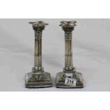 Pair of silver Corinthian Column candlesticks, granulated decoration to sconces, cast acanthus