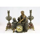 19th century Spelter Figural Cased Clock together with a Pair of Spelter Garnitures