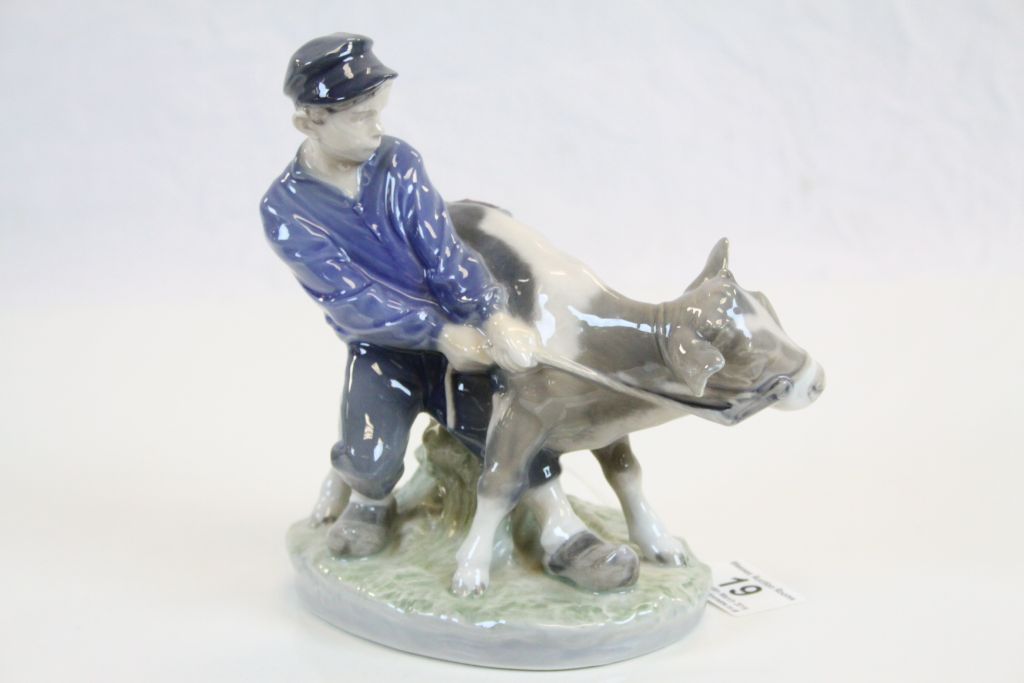 Royal Copenhagen Figure of a Boy holding a Calf, model no 772, 17cms high