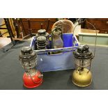 Three Tilley Lamps together with a Chalwyn Storm Lamp and another similar Storm Lamp