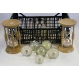 Ten Hafod Grange Dandelion Paperweights together with Two Oak and Ash Hourglasses