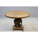 African Hardwood Lamp Table, the oval top above an Elephant Column with Bone Tusks
