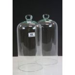 Pair of Glass Domes, 35cms high
