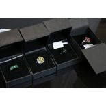 Four gem set rings to include black star diopside silver ring, the oval cabochon cut black