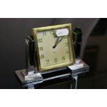 Art Deco 8 day dressing table clock, square champagne dial with green Arabic numerals, black stepped