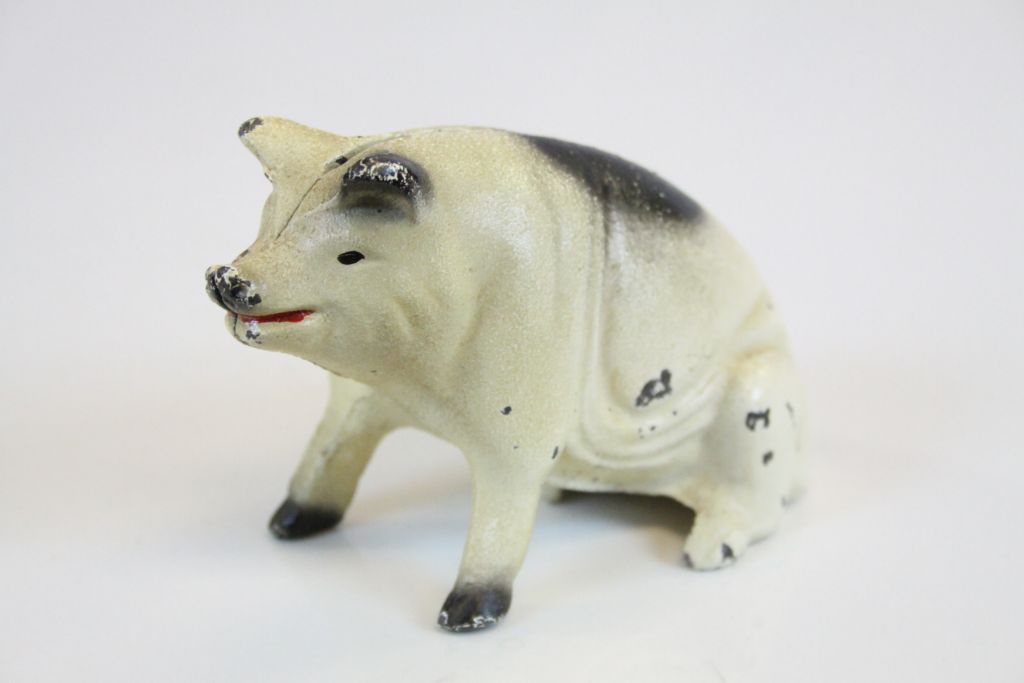 Cast Metal Seated Pig Moneybox marked to base ' Penn, Amish Country, 1965 ' 8cms high