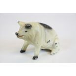 Cast Metal Seated Pig Moneybox marked to base ' Penn, Amish Country, 1965 ' 8cms high