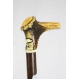 Antique Walking Stick with Carved Dog decoration to the Antler Handle