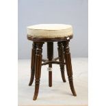 William IV Mahogany Adjustable Circular Piano Stool with Upholstered Seat raised on Four Turned