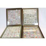 Four Framed, Glazed and Mounted Sets of 50 Cigarette Cards including Players Motor Cars, Players