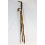 Three Vintage German Walking Sticks, one with Sheep's Horn Handle, each covered in Tourist