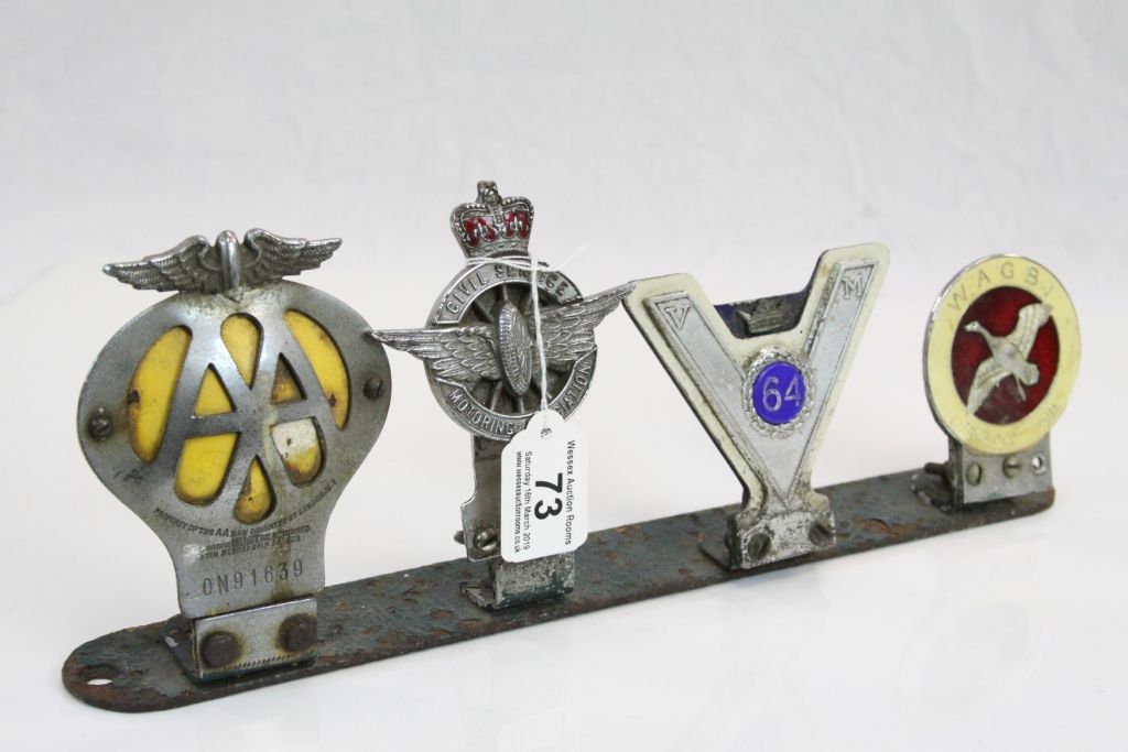 Four Vintage Car Badges including AA, Civil Service Motoring Association, VM 64 and WAGBI, all