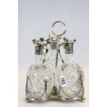 Three white metal mounted cut glass decanters with engraved foliate decoration to collar and