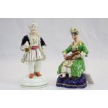 Pair of 19th century Staffordshire Figures comprising a Persian Man and Woman, the man wearing a