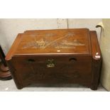 20th century Asian Camphor Wood Blanket Box, the top and sides carved with Village and Fishing