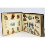 Late Victorian scrap book, containing greetings cards and Christmas cards, cut-out figures, animals,