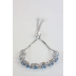 Silver CZ and Blue Topaz Line Bracelet