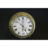 Late 19th / Early 20th century Brass Cased Circular Bulk Head Ship's Clock, the white enamel face