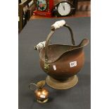 Copper Coal Scuttle with China Handles and a Brass and Copper Jug