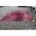 Large Wool Red Ground Rug with a pattern on Geometric Medallions with Border, 375cms x 358cms