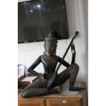 Large Carved Wooden South Asian Seated Buddha playing a Lute, approx. 77cms high