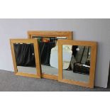 Oak Framed Bevelled Edged Mirror, 86cms x 81cms together with a Pair of Oak Framed Mirrors, 74cms