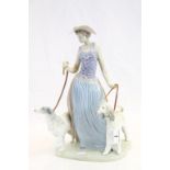 Lladro Figurine ' Elegant Promenade ' model no. 5802 depicting a Woman walking two dogs, 39cms high