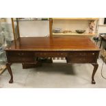 Late 19th century Mahogany Desk with Carved Fluted Edge, Five Drawers and raised on Carved