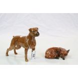 Beswick ceramic model of a Boxer dog and another of a lying down Fox, numbered 1017 to base