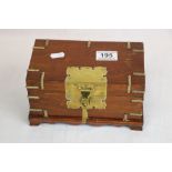 Wooden jewellery box with brass fittings in the form of a travel chest, containing a white metal