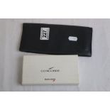 Concorde travel wallet together with a small silver easel back circular photograph frame, engraved