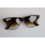 Pair of vintage Ray-Ban sunglasses, tortoiseshell style and white metal frames