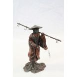 Painted Spelter model of an Oriental Fisherman, stands approx 23cm