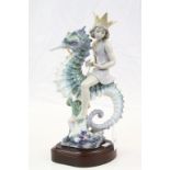 Large Lladro ceramic model "Mermaid on Seahorse", with attached wood effect base, stands approx 32cm