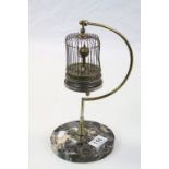 Early 20th Century Japanese "Bird in Cage" key wind Clock with stand and on a circular Marble