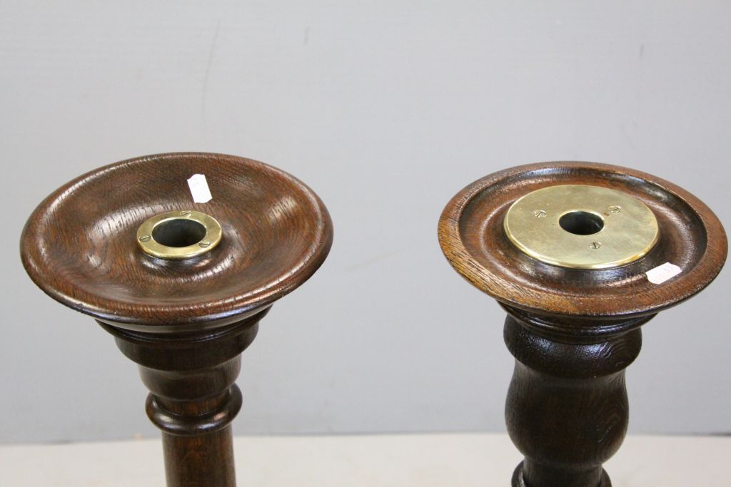 Two similar Oak Standard Candle Stands each set with a Brass Candle Holders and raised on turned - Image 3 of 3