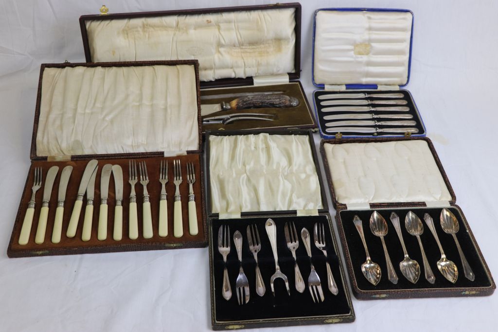 Cased set of six silver handled butter knives, cased set of six ivorine handles fruit knives and