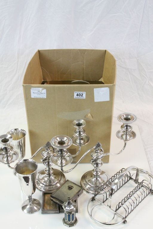 Collection of Silver Plate including a Pair of Two Branch Candelabra, Toast Rack, Goblets, Egg