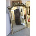 Very Large 19th century Pine and Gilt Framed Overmantle Mirror, the arched top with shell and scroll
