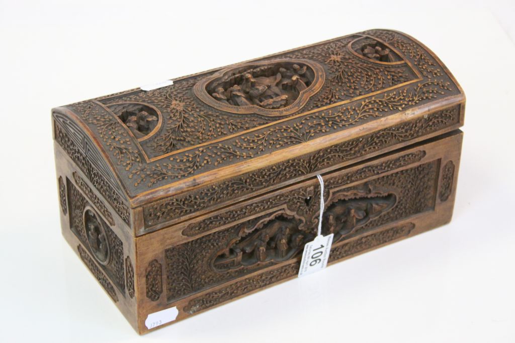 Heavily carved Oriental Wooden Box with hinged lid and Key, measures approx 28 x 14 x 13cm