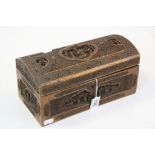 Heavily carved Oriental Wooden Box with hinged lid and Key, measures approx 28 x 14 x 13cm