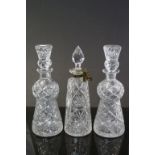 Two vintage cut glass decanters, Thistle design with matching Stoppers and another with attached