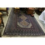 Wool Blue Ground Rug, the Four Central Diamonds to Centre surrounded by Borders with stylised