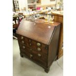 Georgian Mahogany Bureau, the drop front with fitted interior, four long drawers and raised on